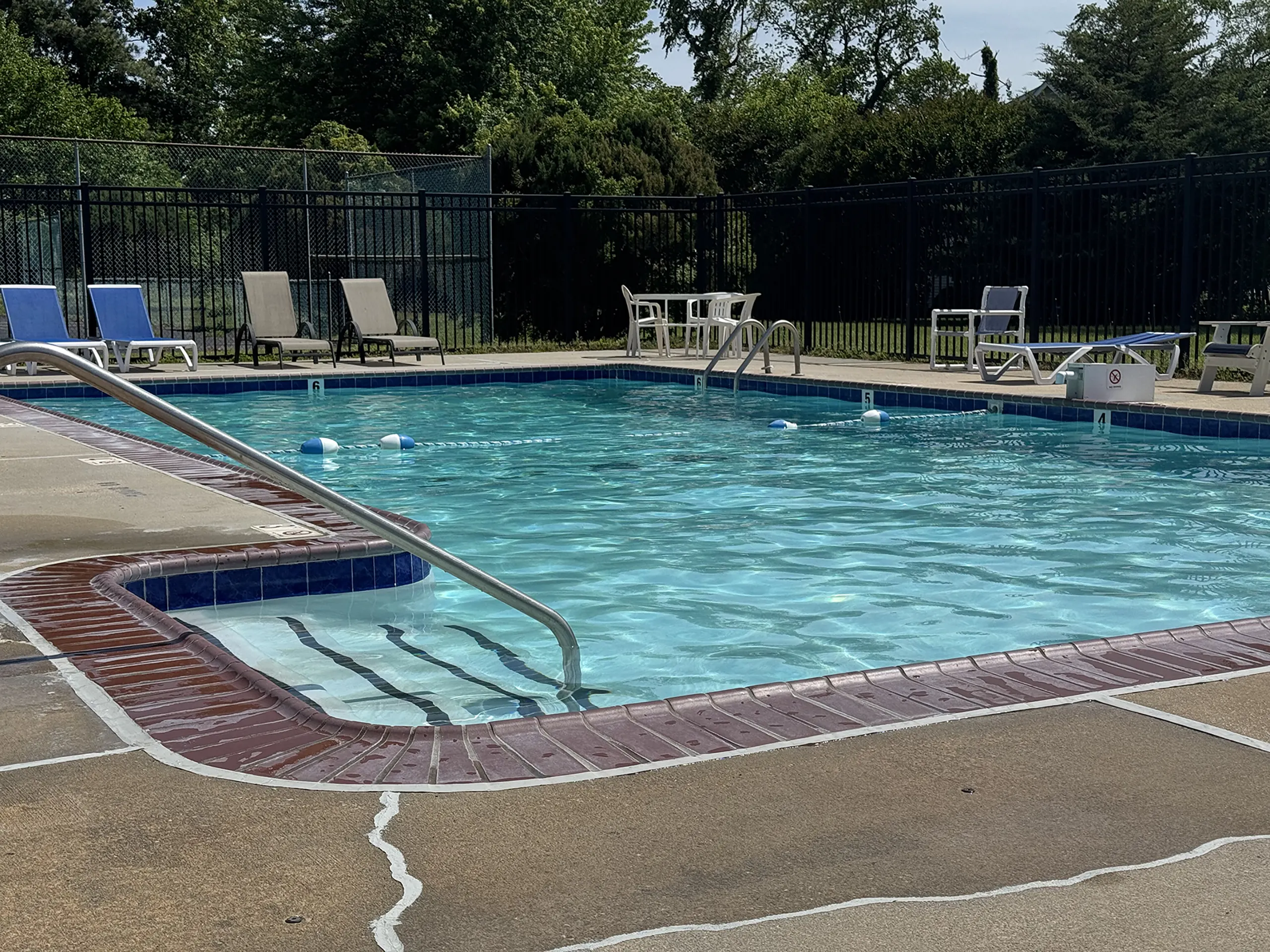 The community pool and lounge chairs