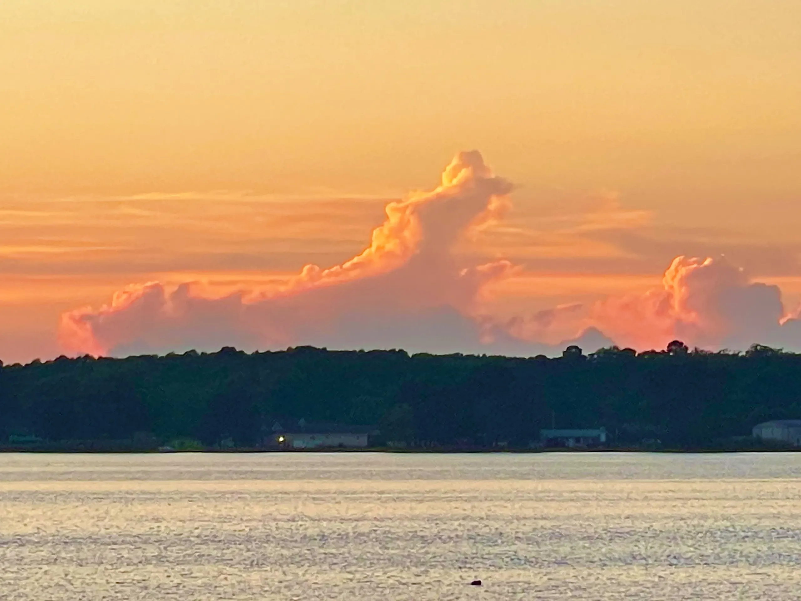 Sunset clouds over the far shore